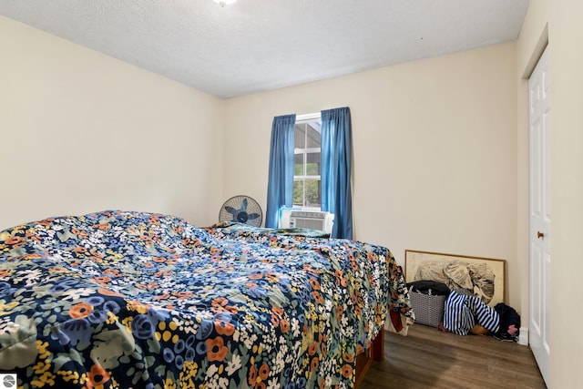 2733 Windcrest Ln, Traverse City, MI 49686 - bedroom with wood finished floors and cooling unit