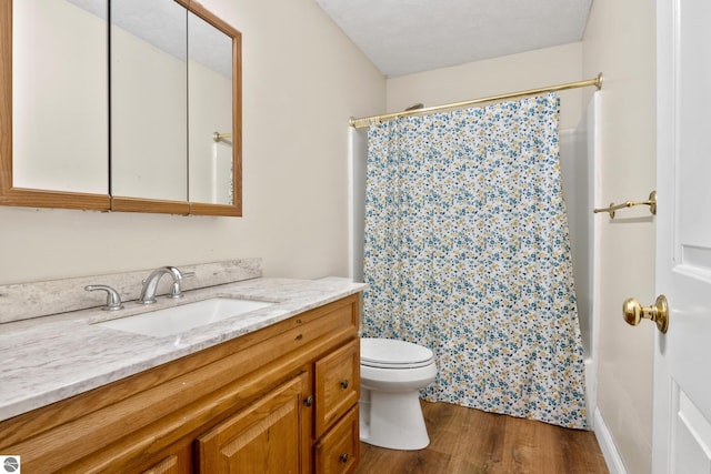 2733 Windcrest Ln, Traverse City, MI 49686 - bathroom featuring vanity, wood finished floors, and shower / tub combo with curtain