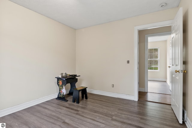 2733 Windcrest Ln, Traverse City, MI 49686 - unfurnished room featuring wood finished floors and a smoke detector