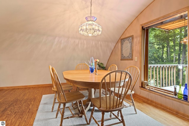 9420 E Traverse Hwy, Traverse City, MI 49684 - dining area with wood finished floors and vaulted ceiling