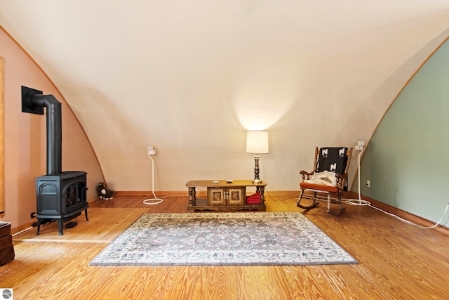 9420 E Traverse Hwy, Traverse City, MI 49684 - living area featuring a wood stove and wood finished floors