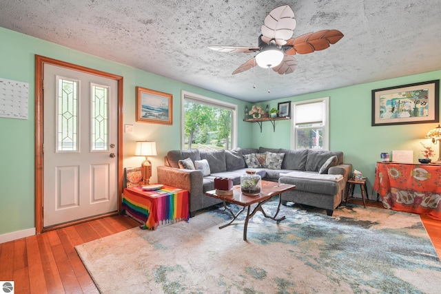 821 Indian Trail Blvd, Traverse City, MI 49686 - living room featuring hardwood / wood-style floors, a textured ceiling, and ceiling fan