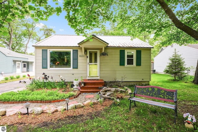 821 Indian Trail Blvd, Traverse City, MI 49686 - bungalow-style house featuring a metal roof