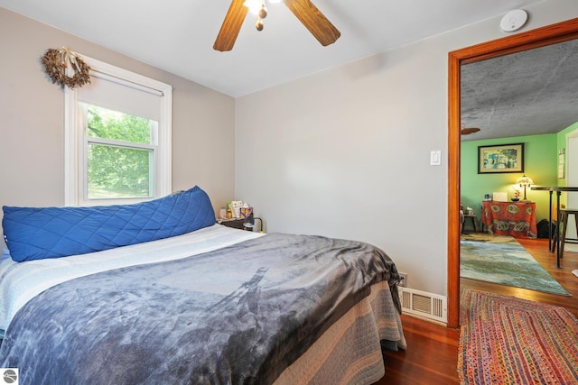 821 Indian Trail Blvd, Traverse City, MI 49686 - bedroom with wood finished floors and ceiling fan