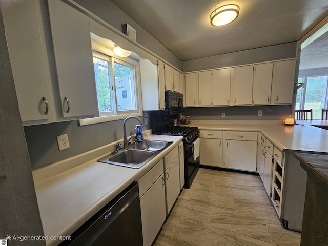 622 W Houghton Lake Rd, Lake City, MI 49651 - kitchen with black appliances, light countertops, and white cabinetry