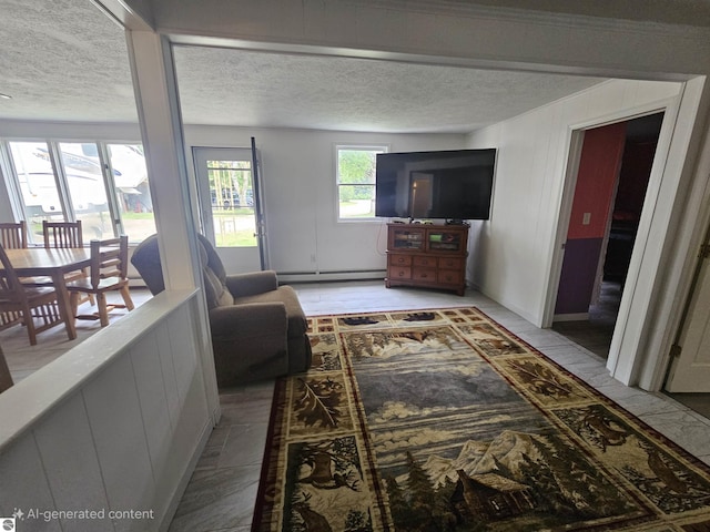 622 W Houghton Lake Rd, Lake City, MI 49651 - living room featuring baseboard heating and a textured ceiling