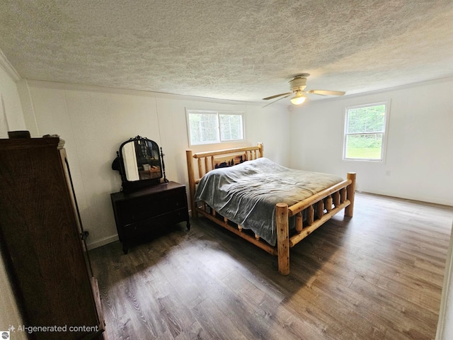 622 W Houghton Lake Rd, Lake City, MI 49651 - bedroom featuring a textured ceiling, multiple windows, wood finished floors, and ceiling fan