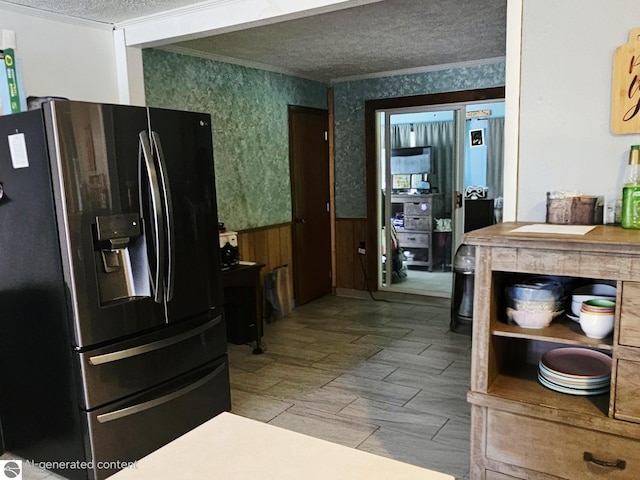 622 W Houghton Lake Rd, Lake City, MI 49651 - kitchen with refrigerator with ice dispenser, a textured ceiling, wallpapered walls, crown molding, and a wainscoted wall