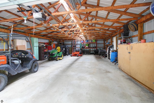 8124 Crisp Rd, Williamsburg, MI 49690 - garage featuring a garage door opener