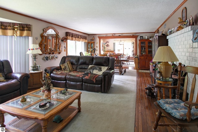 8124 Crisp Rd, Williamsburg, MI 49690 - living area with crown molding, a textured ceiling, and hardwood / wood-style flooring