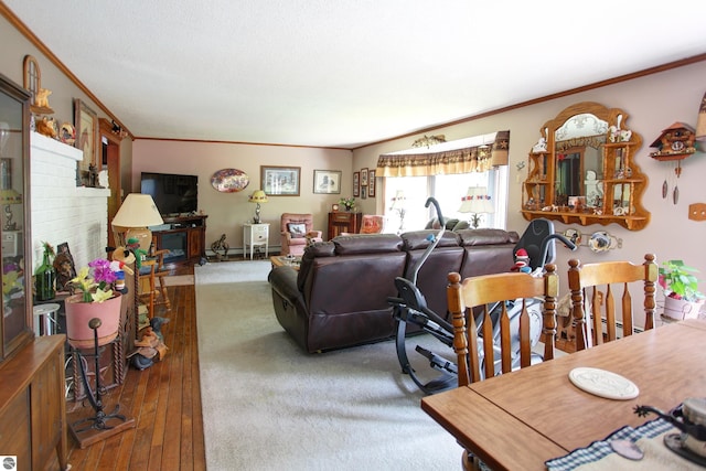 8124 Crisp Rd, Williamsburg, MI 49690 - living room with crown molding and hardwood / wood-style floors