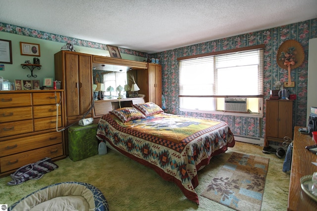8124 Crisp Rd, Williamsburg, MI 49690 - carpeted bedroom featuring wallpapered walls, a textured ceiling, a baseboard heating unit, and cooling unit