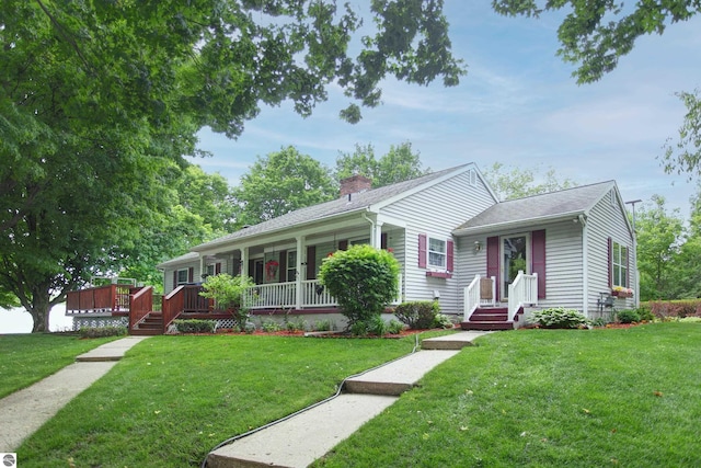 8124 Crisp Rd, Williamsburg, MI 49690 - ranch-style home with a chimney, a front lawn, and roof with shingles