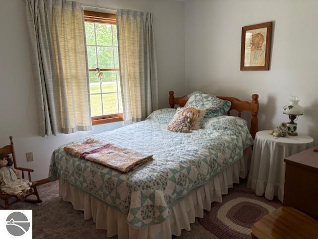 2615 Antelope Trl, West Branch, MI 48661 - bedroom with light colored carpet