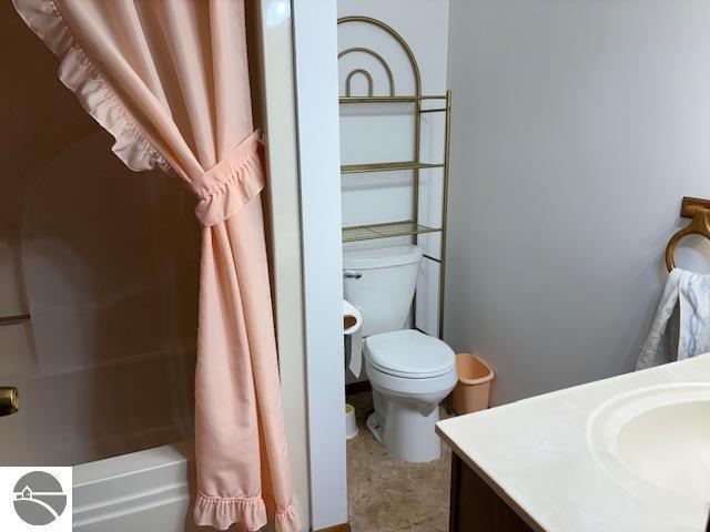 2615 Antelope Trl, West Branch, MI 48661 - bathroom featuring vanity and shower / bath combo