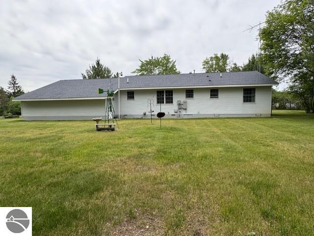 2615 Antelope Trl, West Branch, MI 48661 - rear view of property with a yard and crawl space