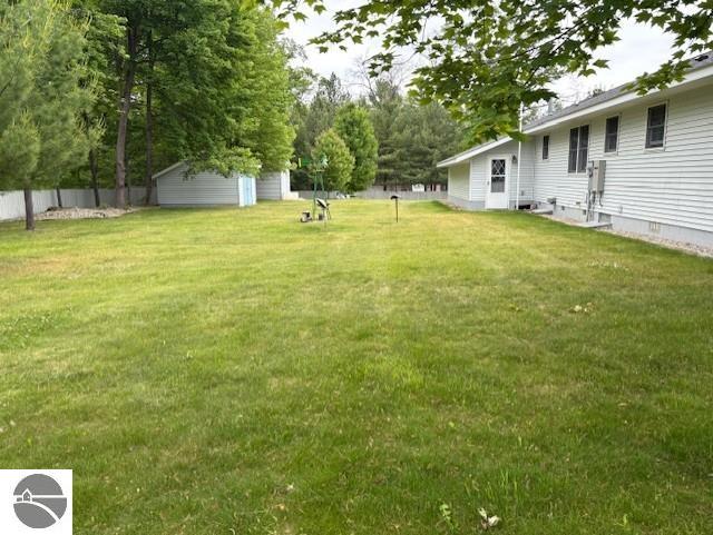 2615 Antelope Trl, West Branch, MI 48661 - view of yard featuring an outbuilding