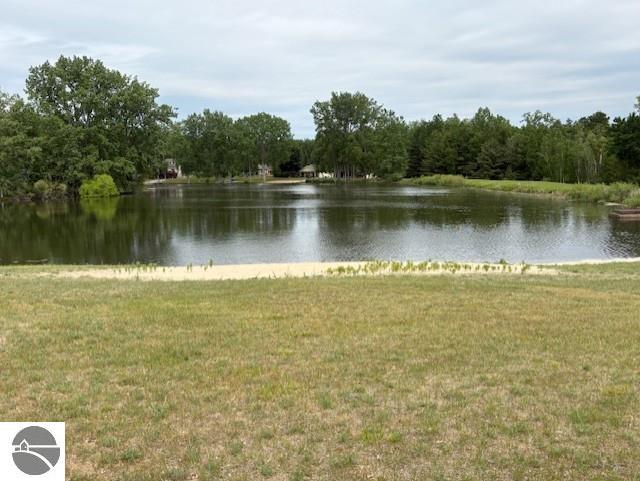 2615 Antelope Trl, West Branch, MI 48661 - water view featuring a forest