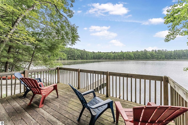 4180 Pintail Dr, Traverse City, MI 49696 - deck featuring a water view and a wooded view