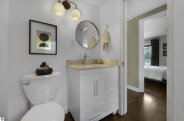 701 Sixth St, Traverse City, MI 49684 - ensuite bathroom with vanity and wood finished floors