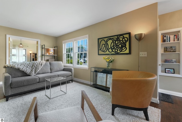 701 Sixth St, Traverse City, MI 49684 - living area with baseboards and wood finished floors