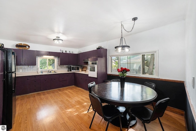 311 E Bennett Ave, Mount Pleasant, MI 48858 - dining space featuring light wood-type flooring