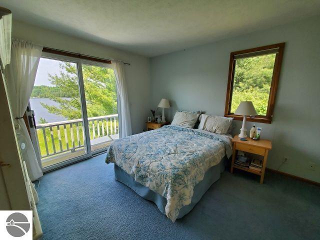 5736 Greenwood Rd, Gladwin, MI 48624 - bedroom featuring carpet floors and access to exterior
