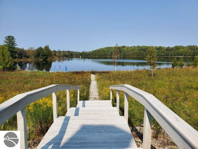 5736 Greenwood Rd, Gladwin, MI 48624 - dock with a water view and a forest view