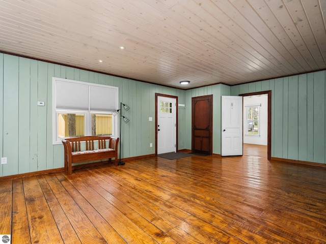 10090 E 48th Rd, Cadillac, MI 49601 - spare room with wood ceiling, wood-type flooring, and wooden walls