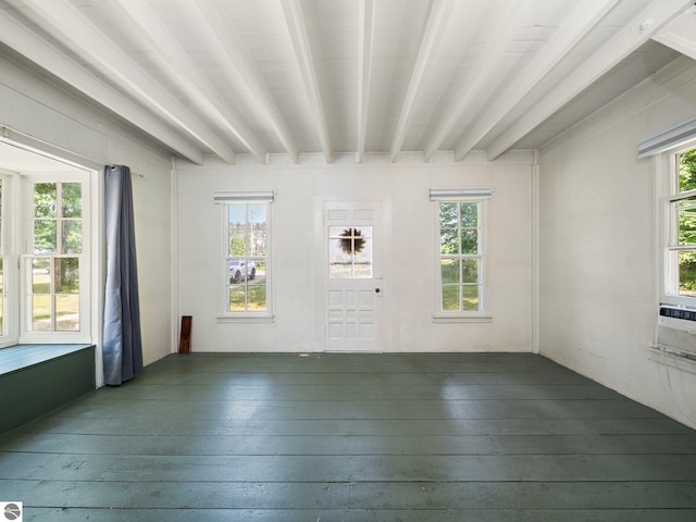 10090 E 48th Rd, Cadillac, MI 49601 - empty room featuring healthy amount of natural light, wood-type flooring, and beamed ceiling