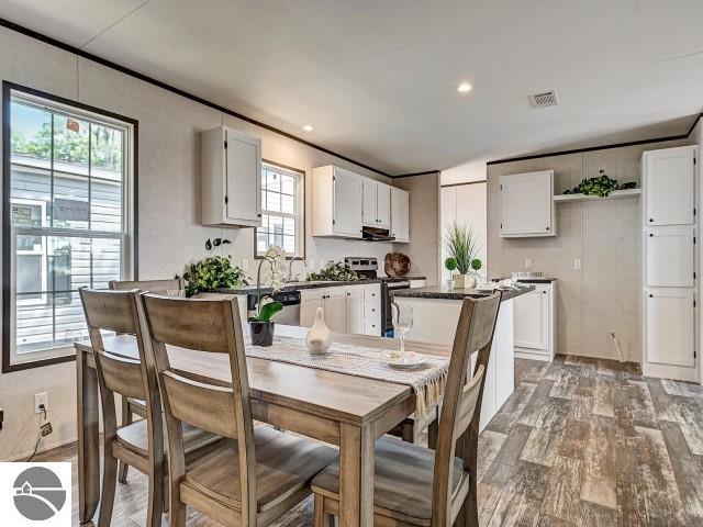 11399 Union St, Fife Lake, MI 49633 - dining room featuring light wood-style flooring and recessed lighting