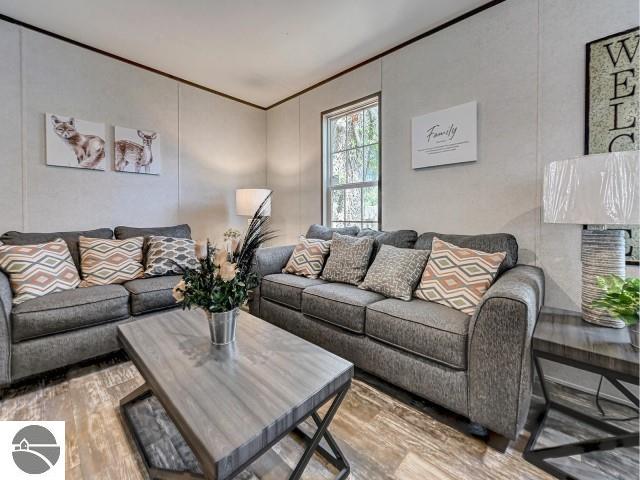 11399 Union St, Fife Lake, MI 49633 - living area featuring wood finished floors
