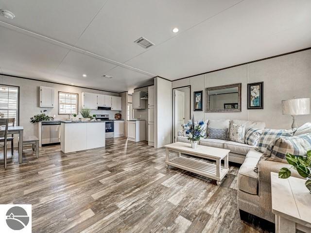 11399 Union St, Fife Lake, MI 49633 - living area with wood finished floors and recessed lighting