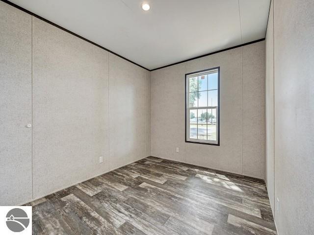 11399 Union St, Fife Lake, MI 49633 - unfurnished room with wood finished floors