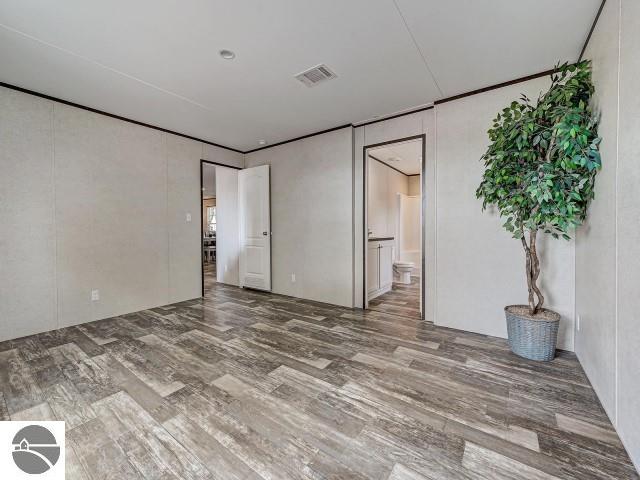 11399 Union St, Fife Lake, MI 49633 - spare room with wood finished floors