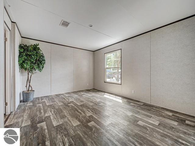11399 Union St, Fife Lake, MI 49633 - empty room featuring wood finished floors