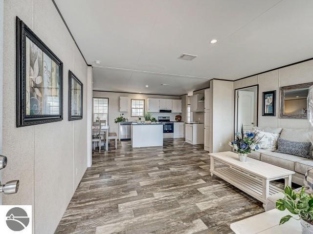11399 Union St, Fife Lake, MI 49633 - living room featuring dark wood-style flooring and recessed lighting