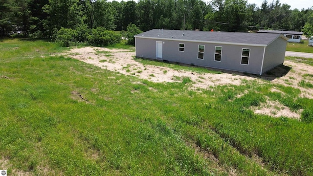 11399 Union St, Fife Lake, MI 49633 - back of house with a forest view