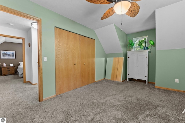 2491 Holland Cir, Traverse City, MI 49685 - unfurnished bedroom with carpet flooring, a closet, and ceiling fan