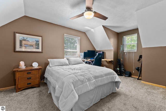 2491 Holland Cir, Traverse City, MI 49685 - carpeted bedroom with lofted ceiling and a ceiling fan