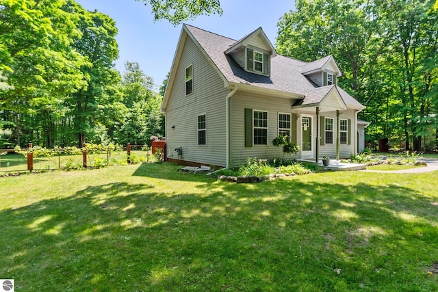 2491 Holland Cir, Traverse City, MI 49685 - cape cod-style house with roof with shingles