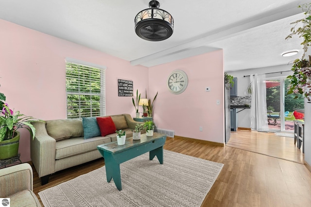 2491 Holland Cir, Traverse City, MI 49685 - living room featuring light wood-style floors and baseboards