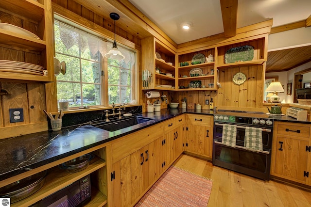 4079 E Oxford Dr, Leland, MI 49654 - kitchen with range with two ovens, open shelves, dark countertops, light wood finished floors, and pendant lighting