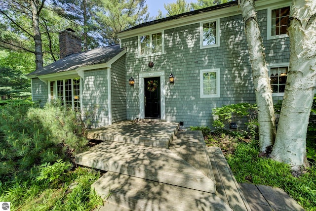 4079 E Oxford Dr, Leland, MI 49654 - view of front of home featuring a chimney
