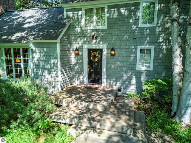 4079 E Oxford Dr, Leland, MI 49654 - property entrance featuring roof with shingles