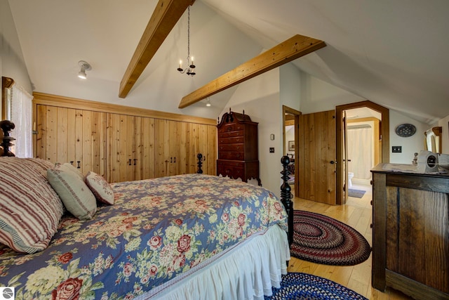 4079 E Oxford Dr, Leland, MI 49654 - bedroom with wood walls and wood-type flooring