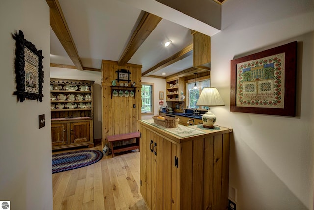 4079 E Oxford Dr, Leland, MI 49654 - kitchen with light wood finished floors, beam ceiling, open shelves, dark countertops, and recessed lighting