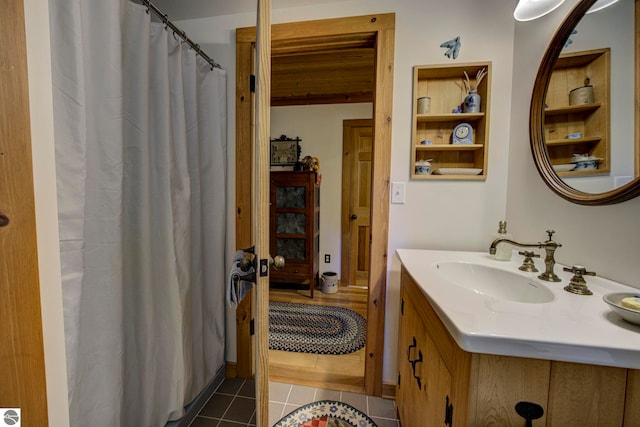 4079 E Oxford Dr, Leland, MI 49654 - bathroom with tile patterned flooring, vanity, built in features, and a shower with shower curtain