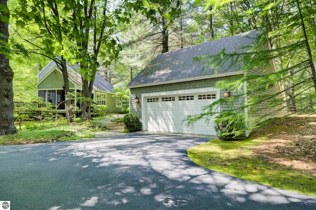 4079 E Oxford Dr, Leland, MI 49654 - garage with asphalt driveway