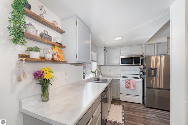 503 N Kinney Ave, Mount Pleasant, MI 48858 - kitchen featuring appliances with stainless steel finishes, dark wood finished floors, open shelves, and light countertops